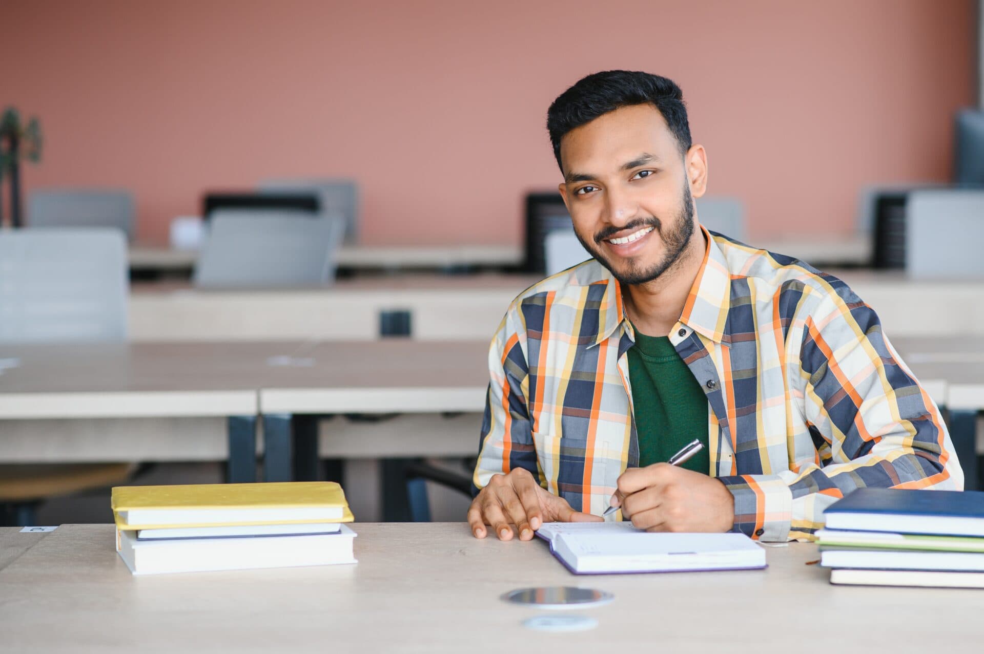 A college student with a notebook