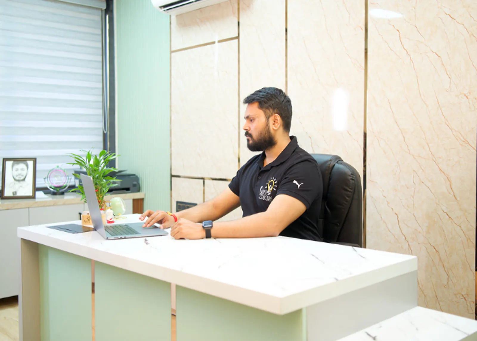 Deepak Sir at his desk at Quest Educare