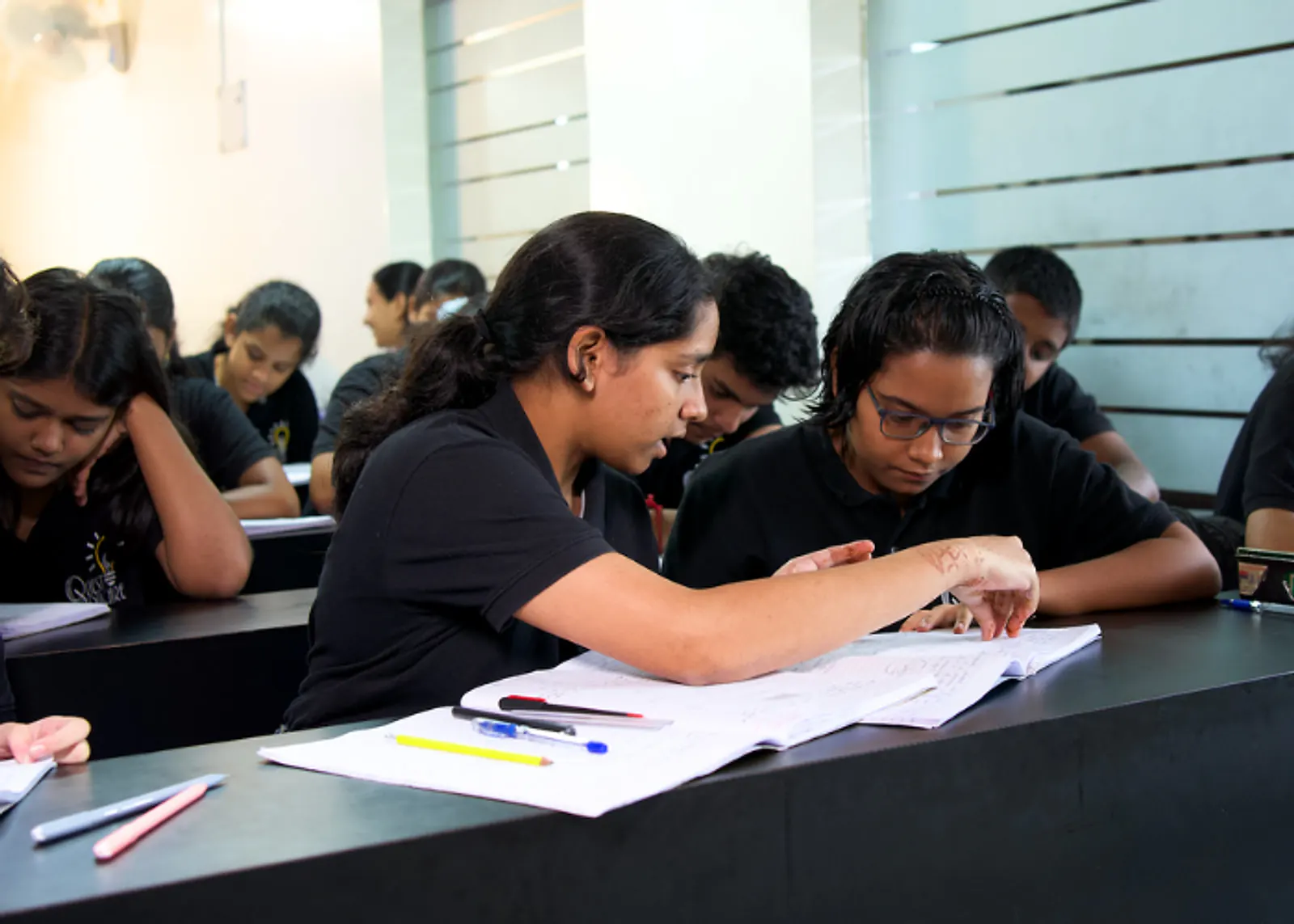 Students working through problems in a Quest Educare class